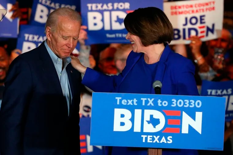 Sen. Amy Klobuchar (right, D-Minn.) and Joe Biden at a campaign rally Monday in Dallas.