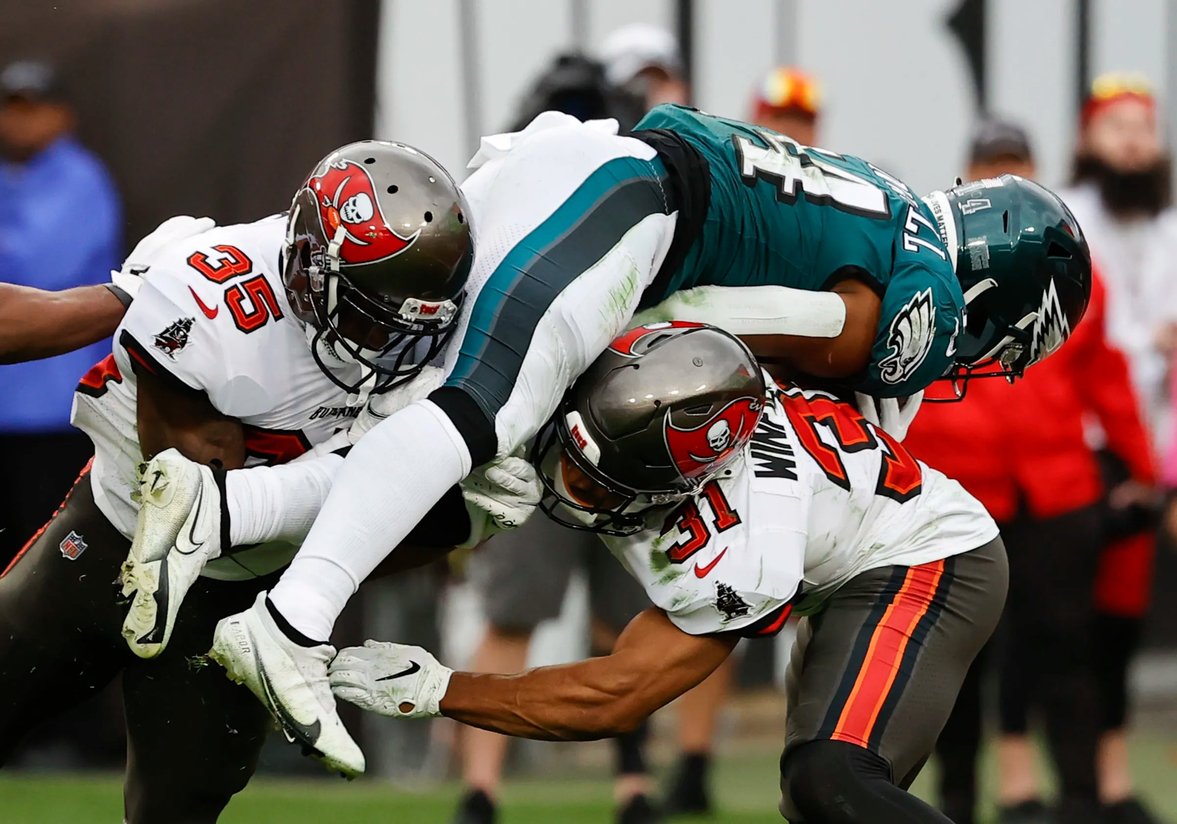 WATCH: Brutal fight breaks out between Buccaneers and Eagles fans during  heated playoff battle
