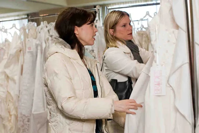 Wedding-gown shoppers look for deals at the Brides Against Breast Cancer tour stop in Raleigh, N.C. The tour, which offers new and used wedding dresses in 40 cities, comes this week to Ramada Philadelphia Airport hotel.