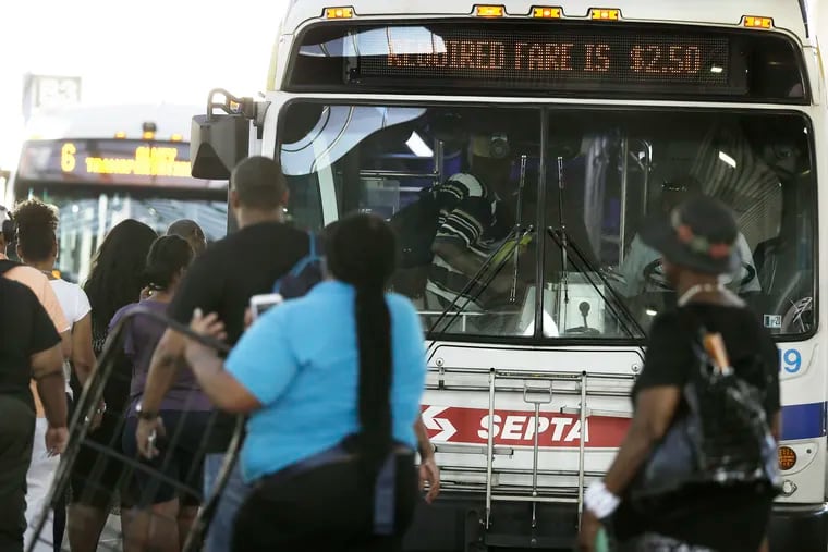 Passengers board a SEPTA bus at the Olney Transportation Center in Philadelphia on Wednesday, July 24, 2019.
