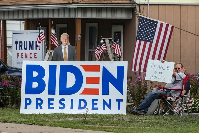 Campaign signs in Exeter Pa., on Tuesday before a rally by Vice President Mike Pence.