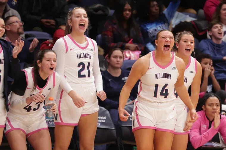 Annie Welde (from left), Kylie Swider, Megan Olbrys, and Kaitlyn Orihel celebrate on the bench during Villanova's victory over Marquette on Wednesday.