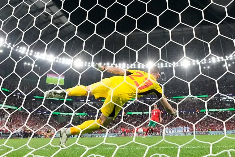 Morocco's Achraf Hakimi scores the decisive penalty during a shootout against Spain at the 2022 World Cup. In 2030, they will be two of the host nations.