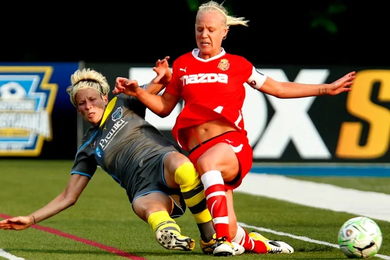 Megan Rapinoe (left) during her short playing tenure with the former Philadelphia Independence in 2011.