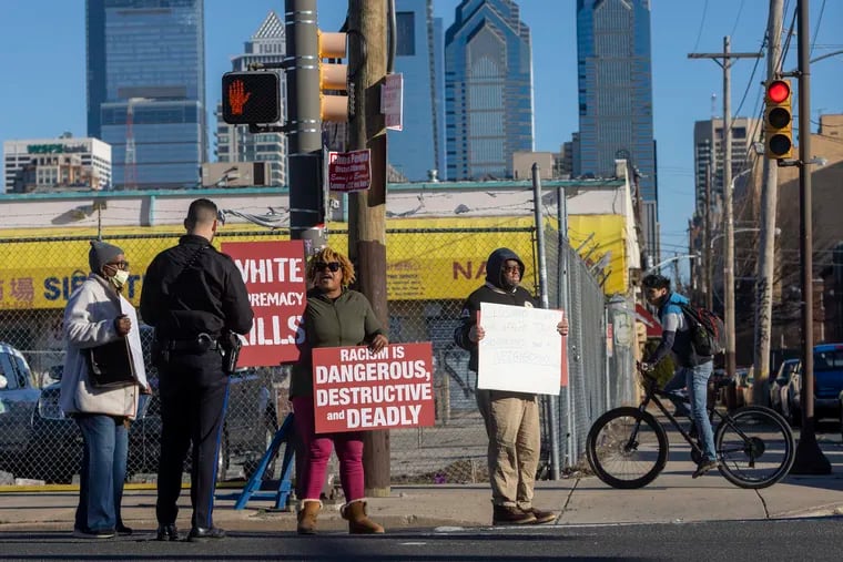 Neighborhood Activists gathered along Washington Avenue at 16th Street in the Point Breeze section of Philadelphia to protest the possible safety overhaul of the street, which would have reduced the number of lanes.