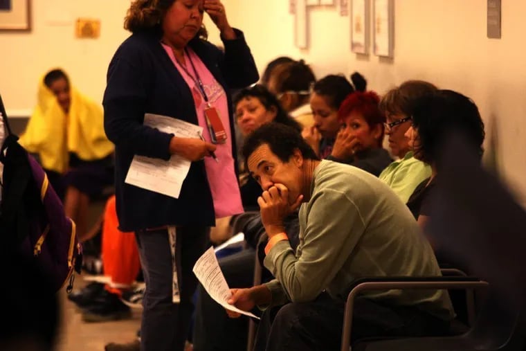 Emergency room visits in the Philadelphia area were typically 3.5 hour long in 2022. This photo shows patients waiting in the triage room of the emergency ward at L.A. County-USC Medical Center in Los Angeles.