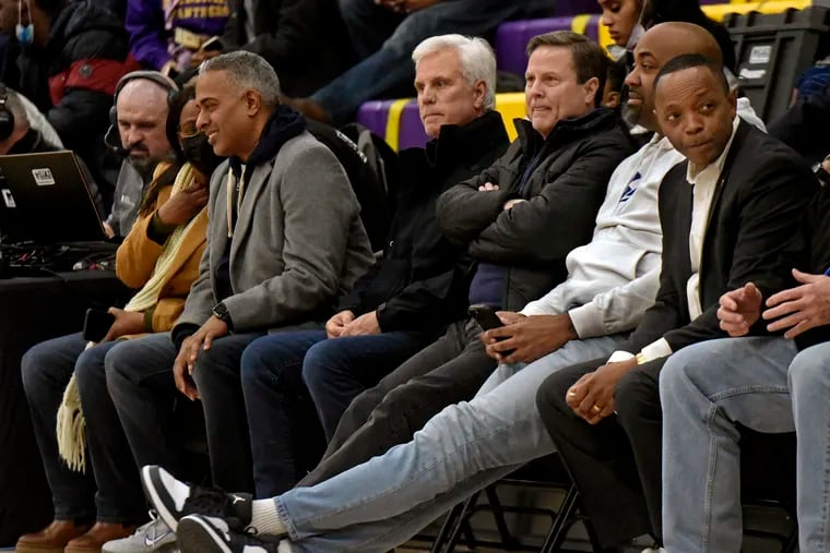 From left: Camden Mayor Vic Carstarphen, South Jersey political power broker George Norcross, U.S. Rep. Donald Norcross, former Assemblyman Arthur Barclay, and Camden Board of Education president Wasim Muhammad attend a Camden High basketball game in March 2022.