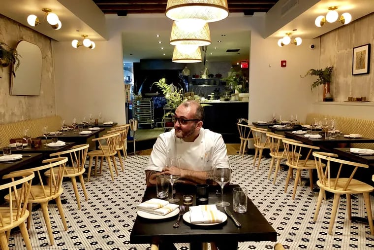 Chef-owner Christopher Kearse takes a preopening break at a table at Forsythia, 233 Chestnut St.