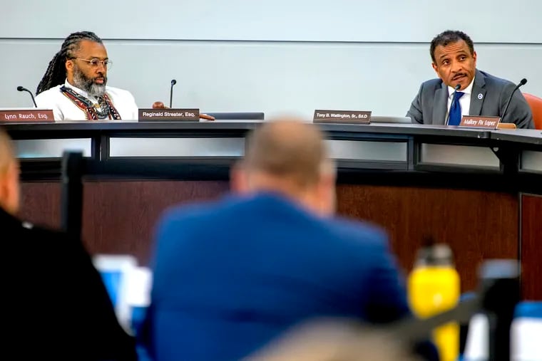 A judge has ruled that the Philadelphia school board was within its rights to limit speakers at its public meetings. Two community groups had challenged the legality of the policy, calling it "speaker suppression." Shown in this May file photo are Philadelphia school board president Reginald Streater (left) and Superintendent Tony B. Watlington Sr. at a board meeting.