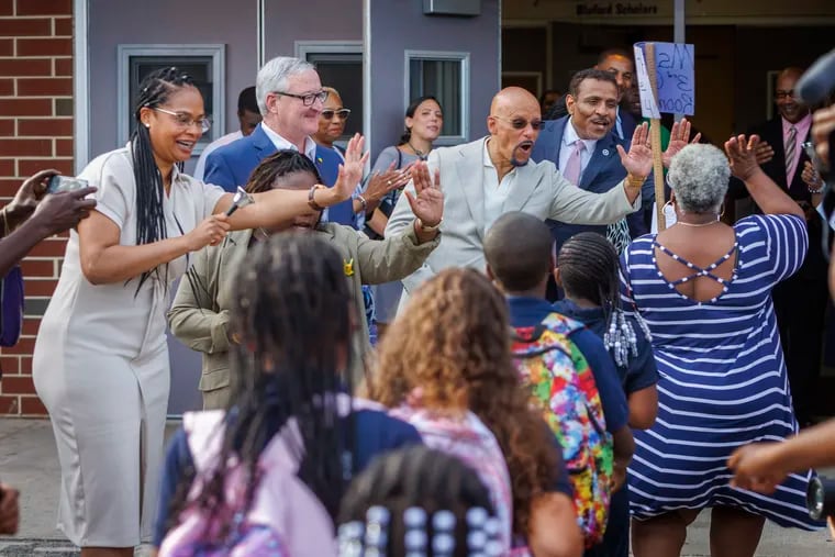 Pennsylvania State Rep. Morgan Cephas, Philadelphia Mayor Jim Kenney, Pennsylvania State Senator Vincent Hughes and Superintendent Tony Watlington of Philadelphia School District greet students on the first day of school at Bluford Elementary School in West Philadelphia.