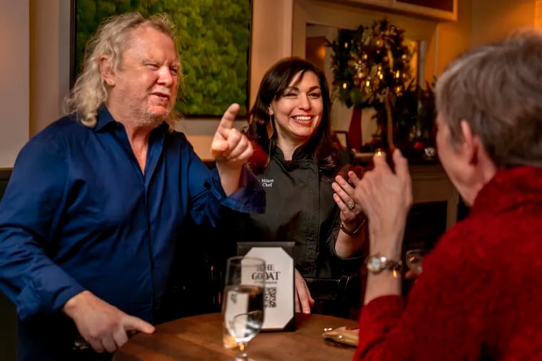 Co-owner Fergus "Fergie" Carey (left) and chef Mackenzie Hilton (right) talk with patrons at the Goat Rittenhouse, Dec. 7, 2021, a new low-key but comfortable neighborhood bar for Rittenhouse Square.