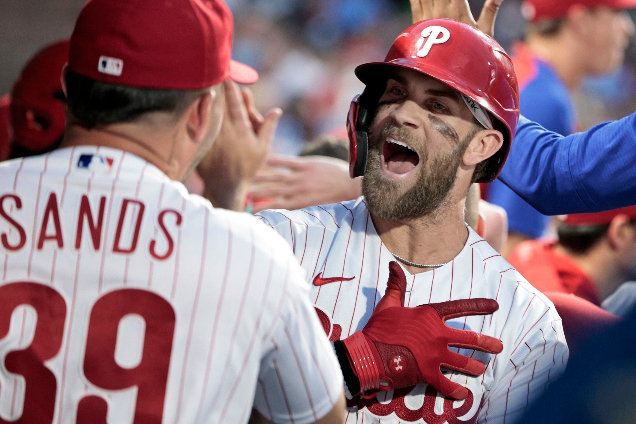 Revere hits rare homer as Phillies beat Nationals in 11