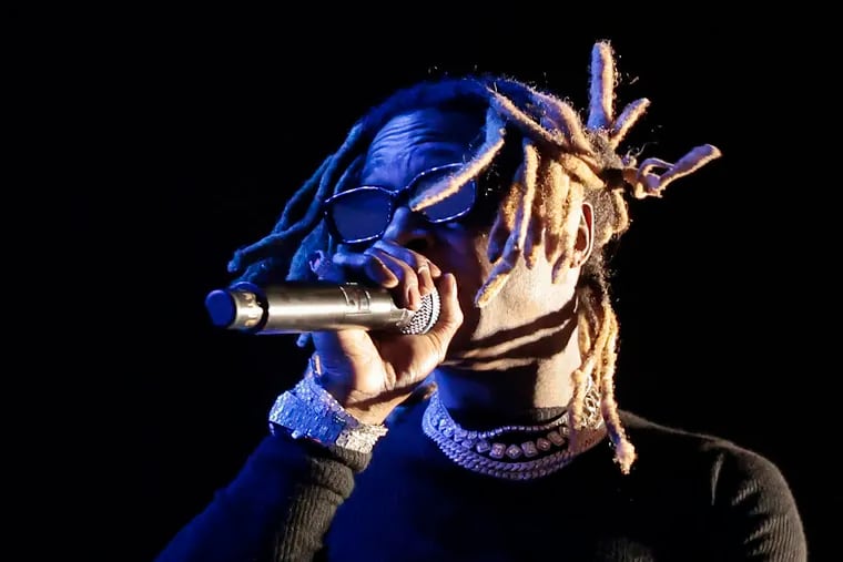 Rapper Lil Wayne performs on Sunday during the Roots Picnic at the Mann Center in Fairmount Park.