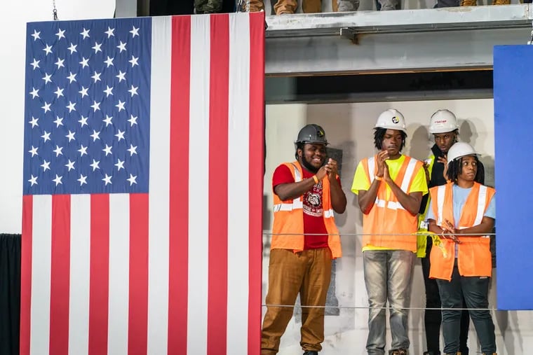 Trades members applaud as Vice President Kamala Harris speaks during an August visit to Philadelphia. After decades of exclusion, the building trades in the city remain predominantly white and male.