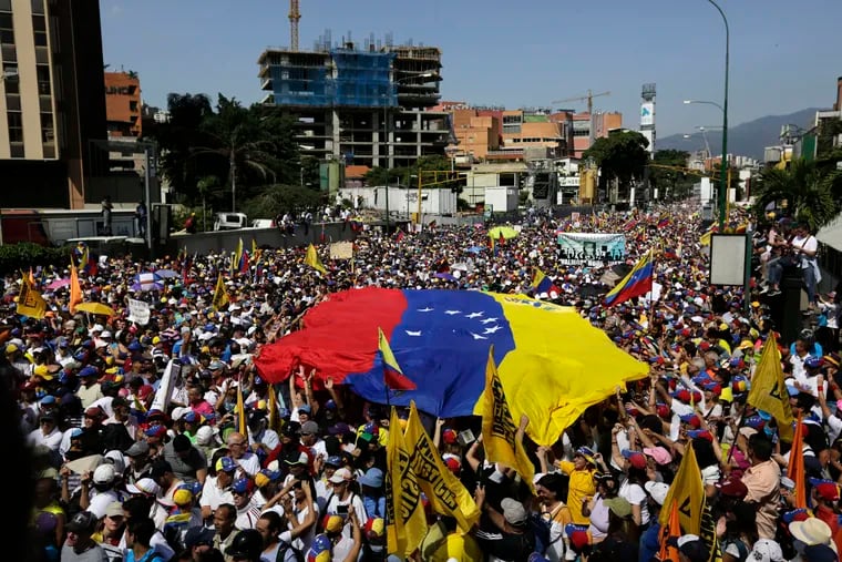 Anti-government protesters gather for the start of a nationwide demonstration demanding the resignation of President Nicolas Maduro, in Caracas, Venezuela, Saturday, Feb. 2, 2019. Momentum is growing for Venezuela's opposition movement led by lawmaker Juan Guaido, who has called supporters back into the streets for nationwide protests Saturday, escalating pressure on embattled Maduro to step down. (AP Photo/Fernando Llano)