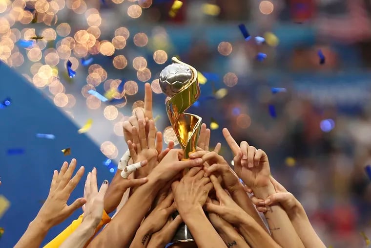 United States players hold the trophy as they celebrate winning the 2019 Women's World Cup final soccer match, but which players specifically have won the most international caps for the team?