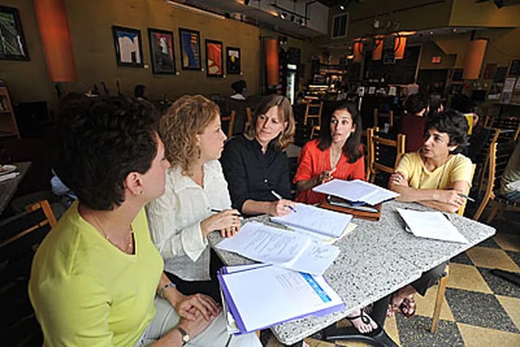 Impact100 Philadelphia held an executive advisory meeting at MilkBoy Coffee in Ardmore. At the meeting are Charlotte Schutzman (left) of Penn Valley, Cheryl Haze of Wynnewood, Mary Broach of Wynnewood, Beth Dahle of Wynnewood, and Ellan Bernstein of Merion Station. Dahle and Broach are co-founders. (Sharon Gekoski-Kimmel / Staff Photographer)