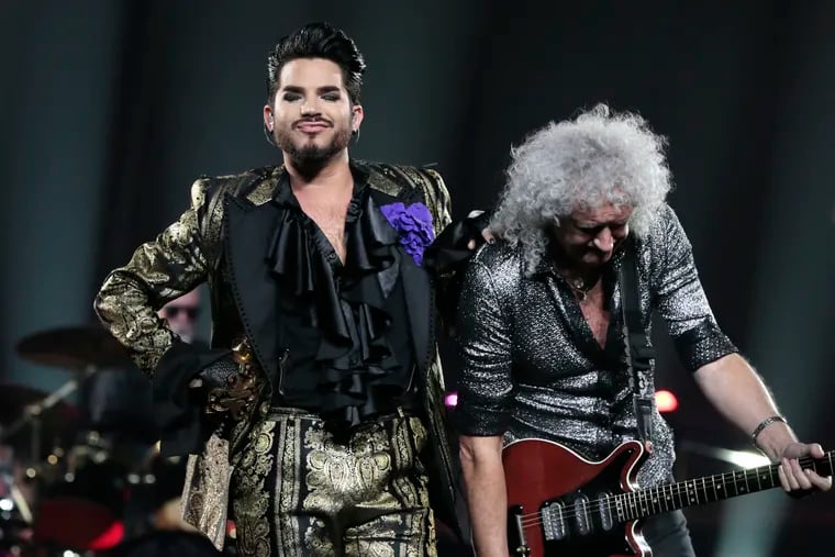 Adam Lambert (left) and Brian May perform during Queen’s The Rhapsody Tour stop at the Wells Fargo Center in Phila., Pa. on August 3, 2019.