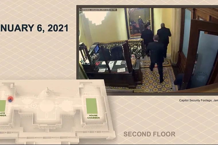 In this image, a security video shows senators leaving the Senate floor as rioters breach the U.S. Capitol. The video was played during the second impeachment trial of former President Donald Trump in the Senate in Washington on Wednesday.