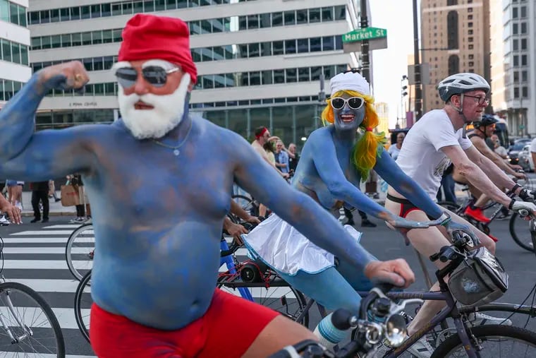 The Philly Naked Bike Ride makes its way around City Hall in Philadelphia on Saturday, Aug. 26, 2023.