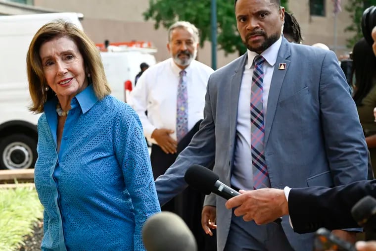 Rep. Nancy Pelosi arrives at the Democratic National Headquarters with other Democratic members of the House of Representatives to discuss the future of President Biden running for the presidency on Tuesday in Washington.