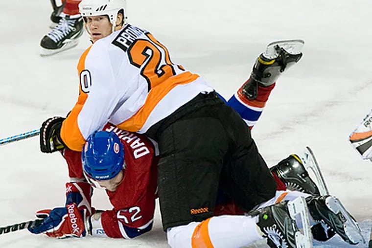 Chris Pronger collides with Montreal Canadiens' Mathieu Darche during second period. (AP Photo/The Canadian Press, Graham Hughes)