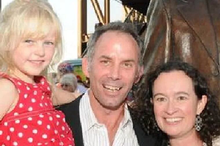 Lawrence J. Nowlan Jr. with wife Heather and daughter Monet in front of his likeness of Phillies broadcaster Harry Kalas, which was dedicated in August 2011.