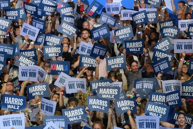 Supporters cheer for Vice President Kamala Harris and Gov. Tim Walz at a rally in Philadelphia's Liacouras Center on August 6, 2024.