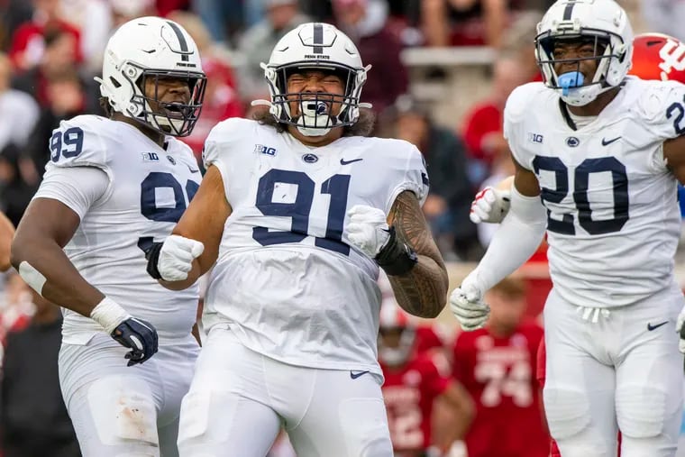 Penn State defensive tackle Dvon Ellies (91) reacts after sacking Indiana quarterback Jack Tuttle in the first half on Saturday. Tuttle was injured on the play.