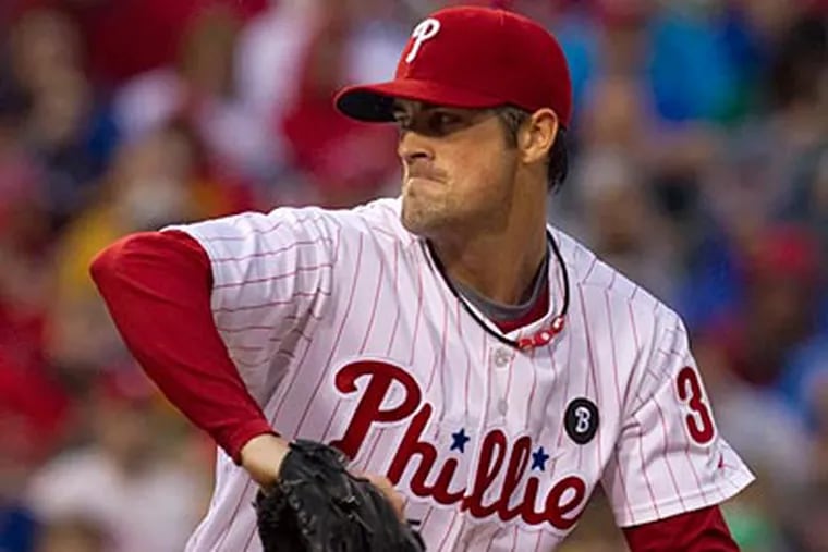 Cole Hamels struck out eight and allowed one run in eight innings against the Rockies. (Ed Hille/Staff Photographer)