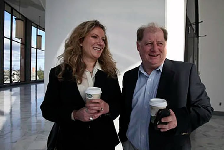 Susan Finkelstein, left, arrives at the Bucks County Courthouse in Doylestown, Bucks County, on Thursday, with her husband, Jack LaVoy, right, to appear on charges she offered sex for World Series tickets in an online ad. (For the Daily News / Joseph Kaczmarek)