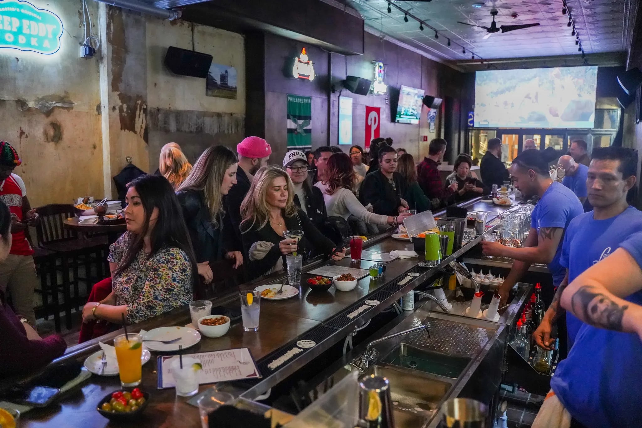 Lucy's, near Rittenhouse Square, on a busy night. On Sept. 6, the bar will be playing the Eagles' Brazil game on the big screens.