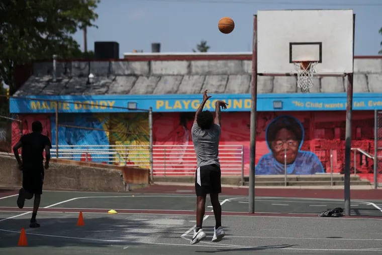 In this 2023 file photo, teenagers work out on the basketball court at the Dendy Recreation Center. The Pew Charitable Trusts found that as the share of Black residents increased in a given neighborhood, the amount of money the city invested in that area’s public spaces decreased.