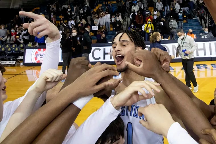 Westtown boys basketball player Dereck Lively II is one of  the top boys players in the country in the senior class  and is headed to Duke.  He celebrates with his teammates after they won the Friends Schools League Basketball Championships against Academy of the New Church on Feb. 18, 2022.