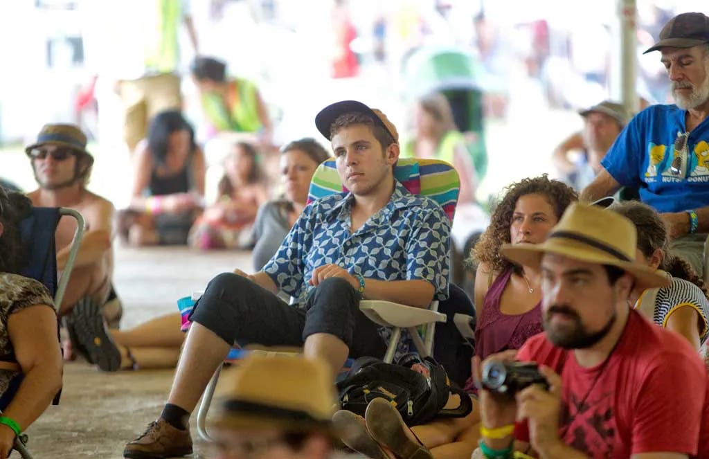 Fans listen as Del Barber, of Manitoba, Canada, performs at the 2013 Philadelphia Folk Festival.  File Photograph