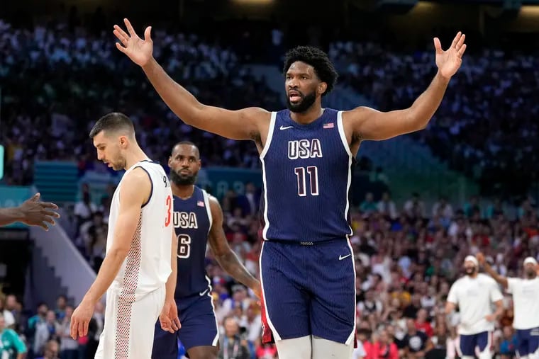 Joel Embiid of the United States reacts after scoring and being fouled against Serbia.