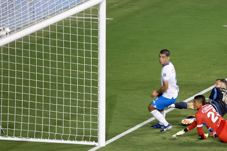 Dániel Gazdag (right) watches his late tying goal against Cruz Azul go in the net