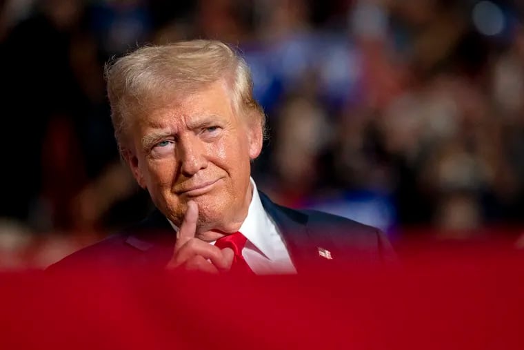 Former President Donald Trump acknowledges the crowd as he arrives onstage at the Pennsylvania Farm Show Complex in Harrisburg, Wednesday, July 31, 2024.