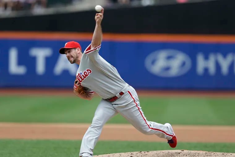 Phillies starter Cliff Lee delivers pitch in the first inning. (Associated Press)