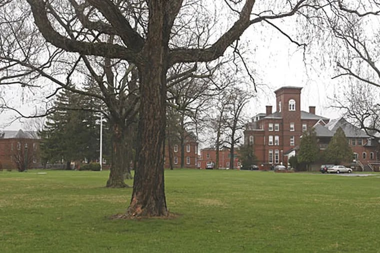 Norristown State Hospital's administration building is shown at right. The hospital's staff were recently cited by state investigators looking into safety lapses after a patient there killed his roommate in July.