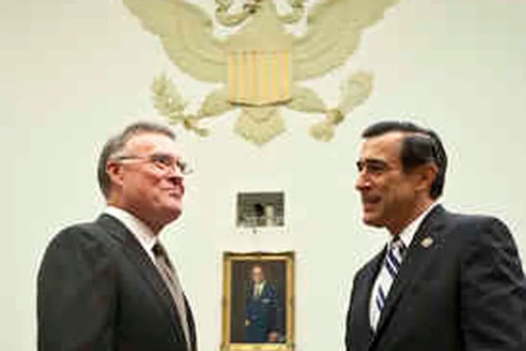 Kenneth D. Lewis (left), CEO of Bank of America, speaks with Rep. Darrell Issa (R., Calif.), before testifying to the House Committee on Oversight and Government Reform. Lewis said yesterday that he proceeded with the Merrill deal because of pressure from regulators.
