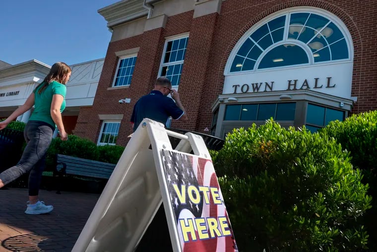 Voters arrive outside their polling place at the Moorestown Town Hall on primary election day Tuesday June  4, 2024.