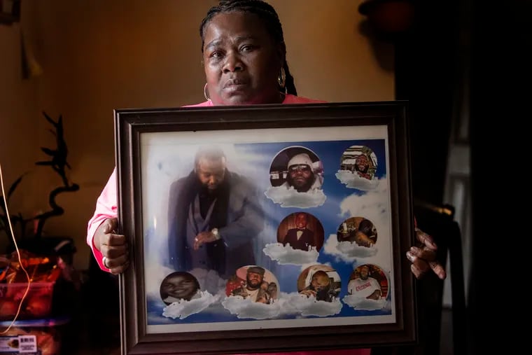 Diane Davis holds photos of her late son, Mike Davis, at her home in Philadelphia, Pa. Thursday, June 11, 2020. Davis' son died while in prison in 2014. The recent uprising over police killing black people has brought back horrible memories and a hope that one day there will be a movement to protect inmates from the officers behind bars.