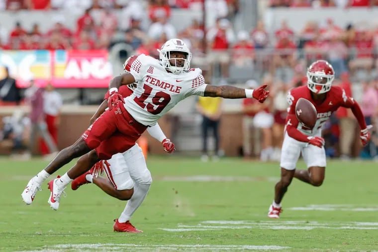 Temple wide receiver Antonio Jones (19) lunges for a pass during the Owls game against Oklahoma last Friday. Next up is a trip to Annapolis to take on American Athletic Conference foe Navy.