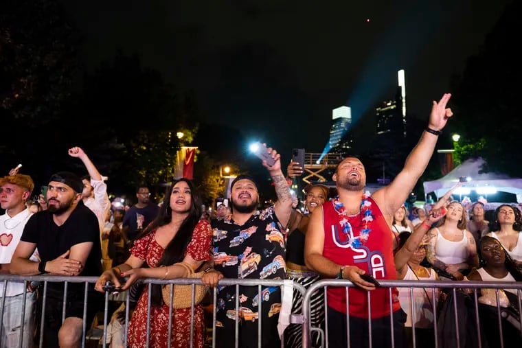 People raise their phone lights as they watch Demi Lovato’s performance at the Wawa Welcome America Festival on Tuesday, July 4, 2023.