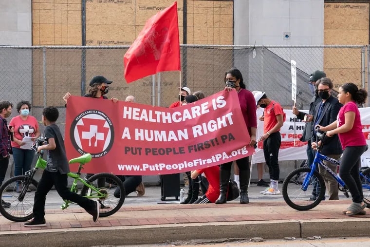 People protest in favor of Medicaid for All on Oct. 1, 2020, in Philadelphia.