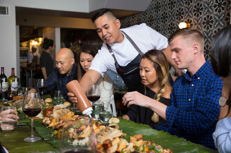 Lou Boquila, chef and owner of Perla, squirts a dash of house banana ketchup at each diner's place for the Sunday meal.