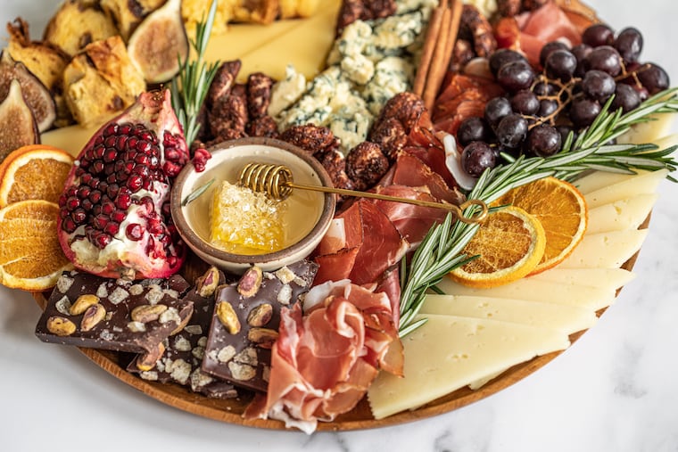 You can buy or build your own custom cheese boards and charcuterie trays like these from Di Bruno Bros., which has several locations throughout the region.