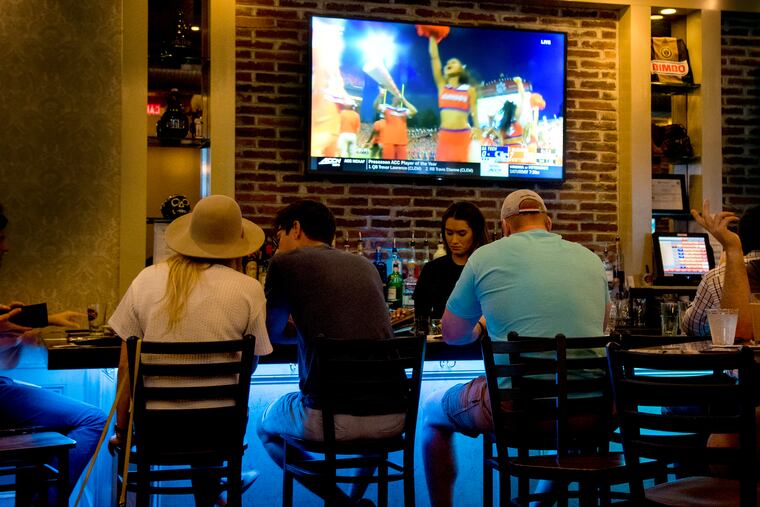 Patrons at the bar at Founding Fathers on South Street in 2019. 