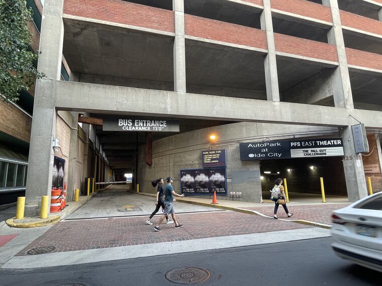 Pedestrians walk past the bus entrance to the Old City garage on Second Street.